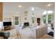 Cozy living room featuring a fireplace, large windows, and comfortable seating for relaxation and gatherings at 2345 Waring Hall Ln, Charleston, SC 29414