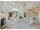 Bright and airy living room with vaulted ceilings, a fireplace, and large windows for natural light at 2345 Waring Hall Ln, Charleston, SC 29414