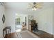 Cozy office space featuring hardwood floors, ceiling fan, desk, and access to outdoor balcony at 2345 Waring Hall Ln, Charleston, SC 29414