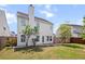 Large backyard with green lawn, a patio area, and mature trees at 243 Longford Dr, Summerville, SC 29483