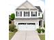 Charming two-story home with a two-car garage and manicured landscaping at 243 Longford Dr, Summerville, SC 29483