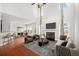 Inviting living room featuring a fireplace, hardwood floors, and modern decor at 243 Longford Dr, Summerville, SC 29483