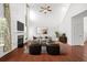 Spacious living room with fireplace, hardwood floors, and abundant natural light at 243 Longford Dr, Summerville, SC 29483