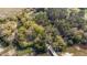 Stunning aerial view showcasing a serene property surrounded by lush trees and natural landscape at 2480 Royal Oak Dr, Johns Island, SC 29455