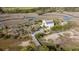 Stunning aerial view showcasing this property set amongst marshland, with a private bridge entrance at 2480 Royal Oak Dr, Johns Island, SC 29455
