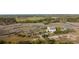 Exceptional aerial view of this riverside property with solar panels, surrounded by marshland and mature trees at 2480 Royal Oak Dr, Johns Island, SC 29455