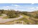 Backyard view features a winding driveway and mature trees, offering privacy and natural beauty at 2480 Royal Oak Dr, Johns Island, SC 29455