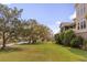 Spacious backyard with mature trees and views of the marshland at 2480 Royal Oak Dr, Johns Island, SC 29455
