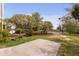 Backyard showcasing a patio, landscaping, and views of the surrounding nature at 2480 Royal Oak Dr, Johns Island, SC 29455
