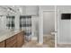 Modern bathroom featuring granite countertops, a tiled shower, and a well-lit vanity at 2480 Royal Oak Dr, Johns Island, SC 29455