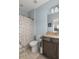 Bathroom features granite vanity with dark wood cabinets and a shower/tub combo with patterned shower curtain at 2480 Royal Oak Dr, Johns Island, SC 29455