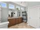 Bathroom with double vanities, shower, and ample natural light creating a spa-like atmosphere at 2480 Royal Oak Dr, Johns Island, SC 29455