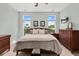Inviting bedroom with plush carpet, large bed, and natural light from picturesque windows at 2480 Royal Oak Dr, Johns Island, SC 29455
