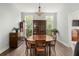Traditional dining room featuring wood table, hutch, chairs, and large windows for natural light at 2480 Royal Oak Dr, Johns Island, SC 29455