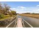 Scenic view of a private dock leading to the river and beautiful marshlands at 2480 Royal Oak Dr, Johns Island, SC 29455