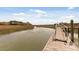 A view looking at the end of the dock to the marshlands and river at 2480 Royal Oak Dr, Johns Island, SC 29455