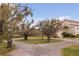 A long winding driveway leading to a beautiful exterior view at 2480 Royal Oak Dr, Johns Island, SC 29455