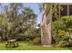 Home's backyard features stairs from the porch to the yard near the lake at 2480 Royal Oak Dr, Johns Island, SC 29455