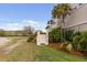 Beautiful home exterior featuring a side porch entrance with lush landscaping and mature palm trees at 2480 Royal Oak Dr, Johns Island, SC 29455