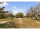 View of the exterior of the home with mature trees and greenery in a rural setting at 2480 Royal Oak Dr, Johns Island, SC 29455