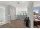 Upstairs hallway with carpet, piano, and views of a bedroom, and a white door leading to another room at 2480 Royal Oak Dr, Johns Island, SC 29455