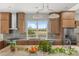 Bright kitchen featuring wooden cabinets, stainless steel appliances, and granite countertops at 2480 Royal Oak Dr, Johns Island, SC 29455