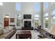 Open living area with natural light, vaulted ceilings, and modern fireplace at 2480 Royal Oak Dr, Johns Island, SC 29455