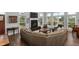 Open-concept living area featuring a fireplace, large windows, and comfortable seating at 2480 Royal Oak Dr, Johns Island, SC 29455