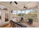 Relaxing screened porch offers serene views, comfortable seating, and ceiling fans at 2480 Royal Oak Dr, Johns Island, SC 29455