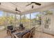 Screened-in porch furnished for relaxation, offering unobstructed views of the surrounding landscape at 2480 Royal Oak Dr, Johns Island, SC 29455