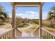 Inviting entrance to the home with a scenic view of the lush greenery and winding driveway at 2480 Royal Oak Dr, Johns Island, SC 29455