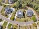 Overhead view of upscale home on landscaped lot with swimming pool and pond in distance at 2504 Ballast Pt, Mount Pleasant, SC 29466