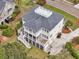 Expansive coastal home featuring outdoor decks, rooftop terrace, and multi-car garage in a desirable neighborhood at 2504 Ballast Pt, Mount Pleasant, SC 29466