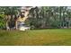A serene backyard featuring lush green lawn and a picturesque pond, ideal for relaxing and enjoying nature at 2504 Ballast Pt, Mount Pleasant, SC 29466