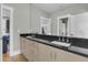 Double vanity bathroom with granite countertops and beige cabinets, offering a spacious and functional design at 2504 Ballast Pt, Mount Pleasant, SC 29466
