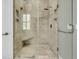 A glass shower features tiled walls, a built-in bench, and dual shower heads for a spa-like experience at 2504 Ballast Pt, Mount Pleasant, SC 29466