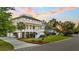 Inviting two-story coastal home with a spacious front porch and landscaped yard, creating a welcoming curb appeal at 2504 Ballast Pt, Mount Pleasant, SC 29466
