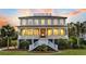 Stately two-story home featuring a classic design with a covered porch and mature landscaping for enhanced privacy at 2504 Ballast Pt, Mount Pleasant, SC 29466