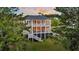 A tree-lined home featuring double porches offering stunning sunset views, and easy access to nearby scenic trails at 2504 Ballast Pt, Mount Pleasant, SC 29466