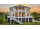 Relax in style at this home with double porches, outdoor living space and a basketball hoop for Gathering fun at 2504 Ballast Pt, Mount Pleasant, SC 29466