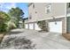 Spacious four-car garage with an expansive concrete driveway and well-kept landscaping at 2504 Ballast Pt, Mount Pleasant, SC 29466