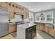 Gourmet kitchen with stainless steel appliances, marble counters, and a center island at 2504 Ballast Pt, Mount Pleasant, SC 29466