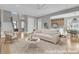 Staged living room with comfortable seating, neutral decor, and a view into the dining area and kitchen at 2504 Ballast Pt, Mount Pleasant, SC 29466