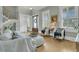 Comfortable living room with a white sofa, wood floors, and a view into the entryway and staircase at 2504 Ballast Pt, Mount Pleasant, SC 29466