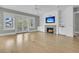 Bright living room with fireplace, built-in shelves, and french doors to balcony at 2504 Ballast Pt, Mount Pleasant, SC 29466