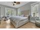 Serene main bedroom with a private balcony, side tables, and plush king bed at 2504 Ballast Pt, Mount Pleasant, SC 29466