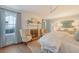 Bedroom features a fireplace, two chairs, and a decorative gold mirror at 304 Bank St, Mount Pleasant, SC 29464