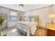 Charming bedroom with a decorative bed, colorful rug, and light blue trim around the window at 304 Bank St, Mount Pleasant, SC 29464