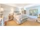 Bedroom with a large bed, wood floors, and a decorative rug at 304 Bank St, Mount Pleasant, SC 29464