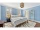 Comfortable bedroom with two lamps, a decorative area rug, and shuttered windows at 304 Bank St, Mount Pleasant, SC 29464